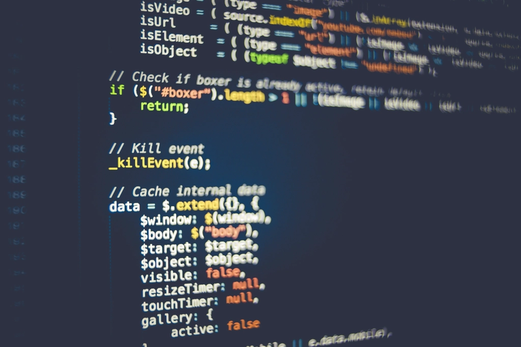 Illustrative image: code on screens in a server room, symbolising AI models running exploit tests.